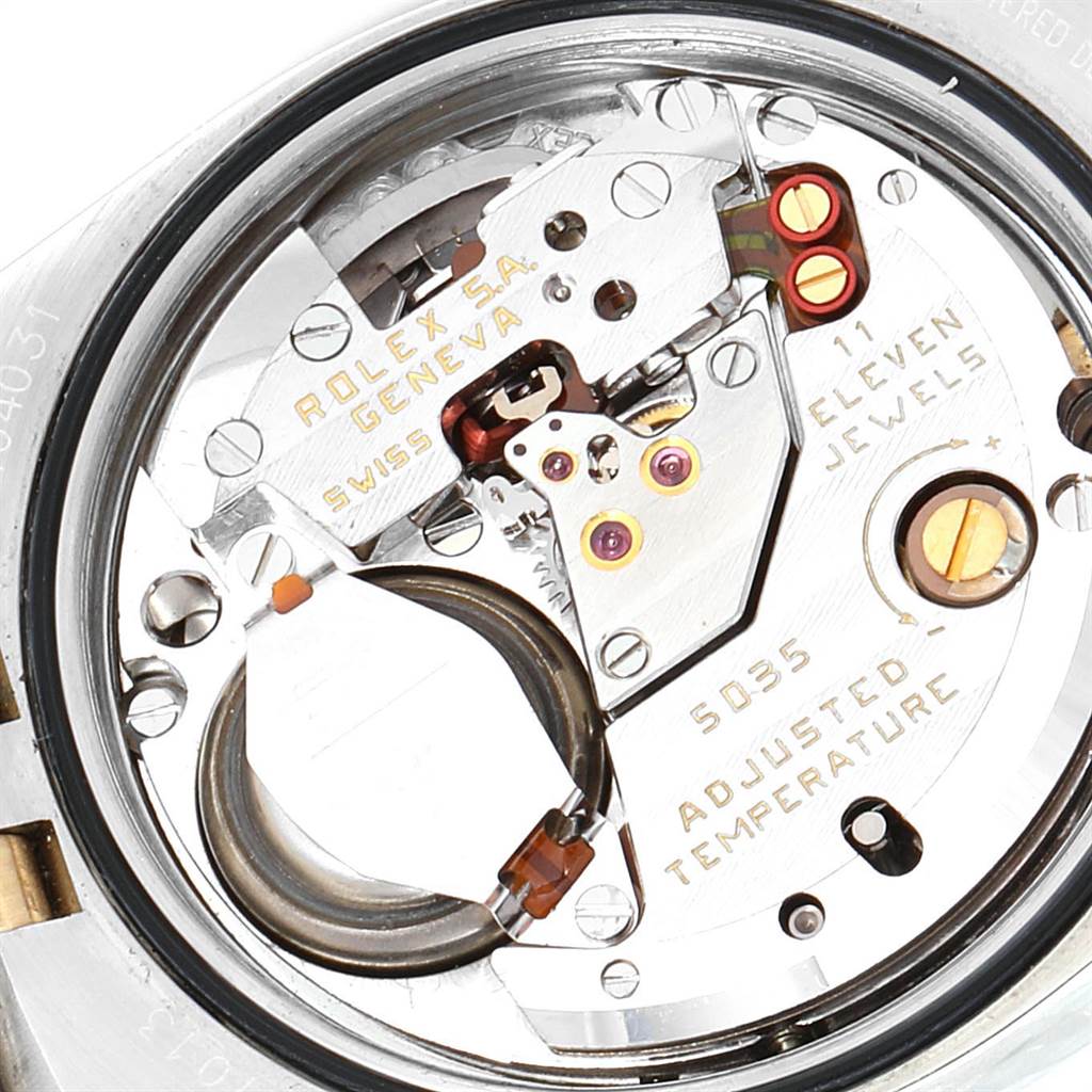 The image shows a detailed view of the internal movement parts of a Rolex Oysterquartz 17013 Men
s Stainless Steel Champagne Dial 17013 Men
s Stainless Steel Champagne Dial watch.