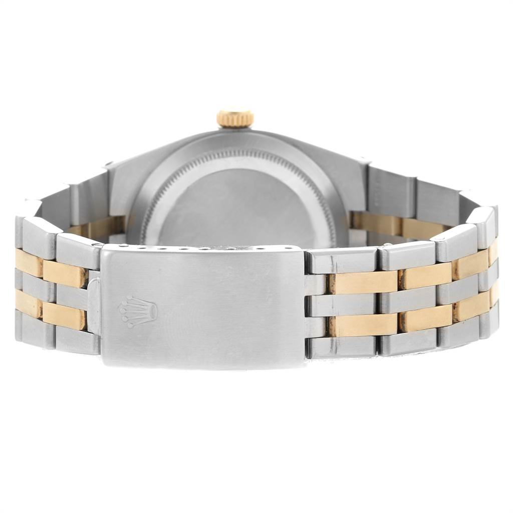 This image shows the back case and clasp of a Rolex Oysterquartz 17013 Men
s Stainless Steel Champagne Dial 17013 Men
s Stainless Steel Champagne Dial watch, highlighting its two-tone metal bracelet.
