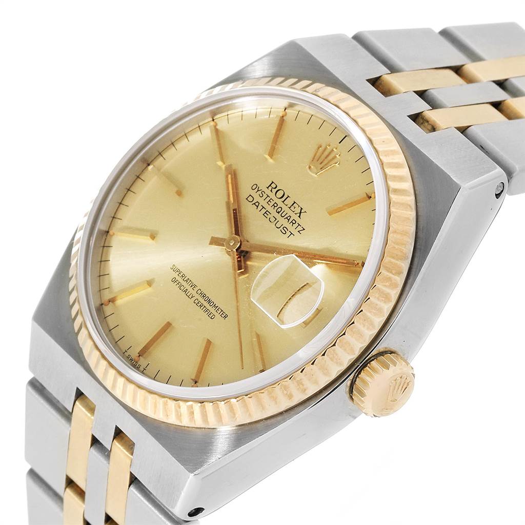 The image shows a close-up, angled view of a Rolex Oysterquartz 17013 Men
s Stainless Steel Champagne Dial 17013 Men
s Stainless Steel Champagne Dial watch, highlighting its dial, crown, and part of its bracelet.