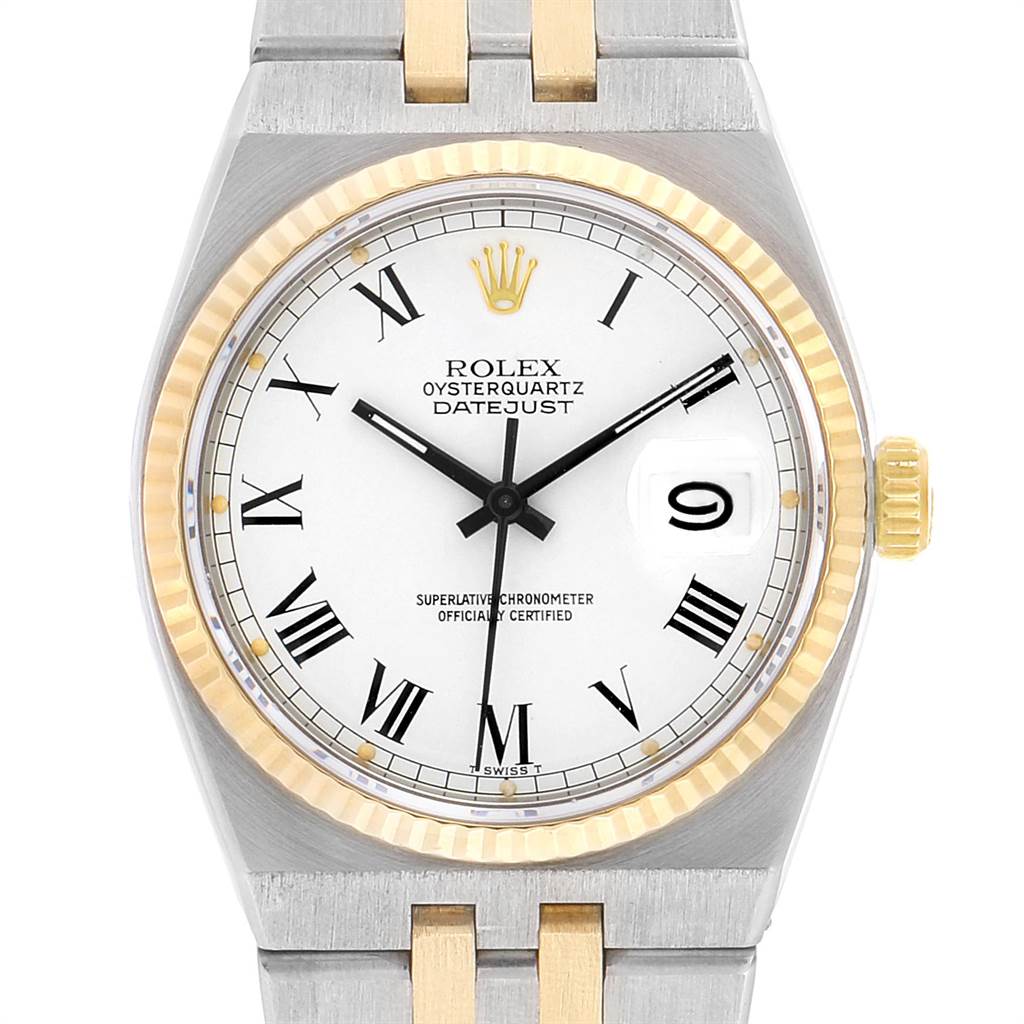 The image shows a front view of the Rolex Oysterquartz 19220 Men's Steel and Gold (two tone) White Dial 19220 Men's Steel and Gold (two tone) White Dial Datejust watch focusing on the dial, bezel, and part of the bracelet.