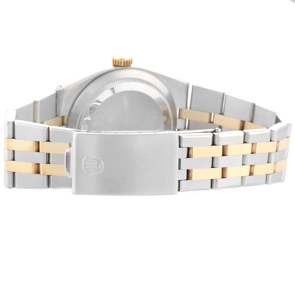 The image shows a Rolex Oysterquartz 19220 Men's Steel and Gold (two tone) White Dial 19220 Men's Steel and Gold (two tone) White Dial watch viewed from the backside, highlighting the clasp and the bracelet.