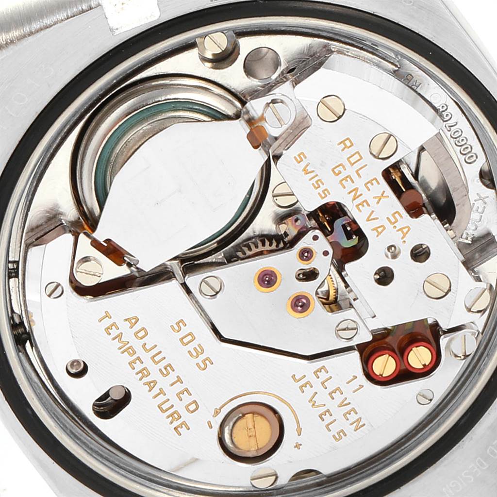 The image shows a close-up view of the internal mechanics of a Rolex Oysterquartz 19220 Men's Steel and Gold (two tone) White Dial 19220 Men's Steel and Gold (two tone) White Dial watch model.