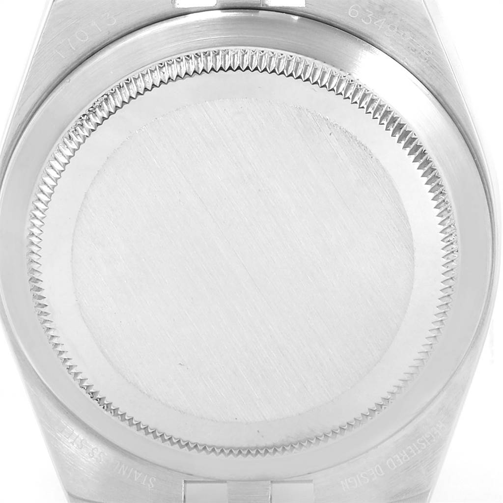 The image shows the case back of a Rolex Oysterquartz 19220 Men's Steel and Gold (two tone) White Dial 19220 Men's Steel and Gold (two tone) White Dial watch.