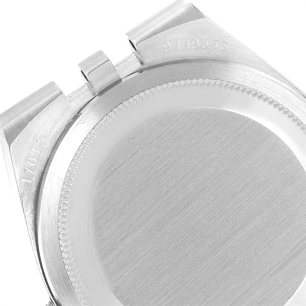 This image shows a close-up of the back case of a Rolex Oysterquartz 17013 Men's Stainless Steel White Dial 17013 Men's Stainless Steel White Dial watch, including the serial and model numbers.