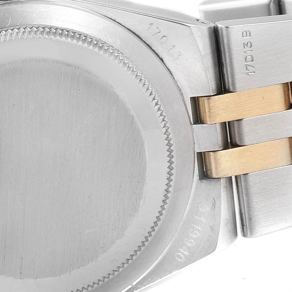 This image shows the case back and part of the bracelet of a Rolex Oysterquartz 17013 Men
s Stainless Steel Champagne Dial 17013 Men
s Stainless Steel Champagne Dial watch, model 17013.