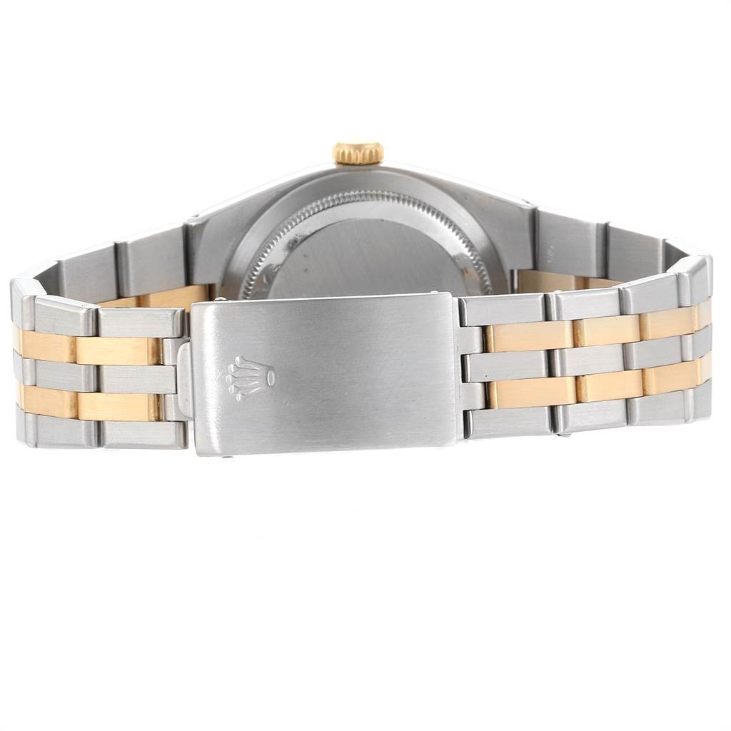 The image shows the back and clasp of a Rolex Oysterquartz 17013 Men's Stainless Steel White Dial 17013 Men's Stainless Steel White Dial watch, highlighting the two-tone metal bracelet.