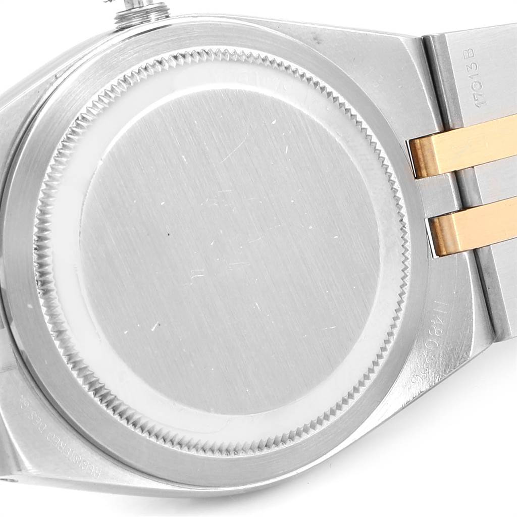 The image shows the back case and part of the bracelet of a Rolex Oysterquartz 17013 Men's Stainless Steel White Dial 17013 Men's Stainless Steel White Dial watch at a slight angle.