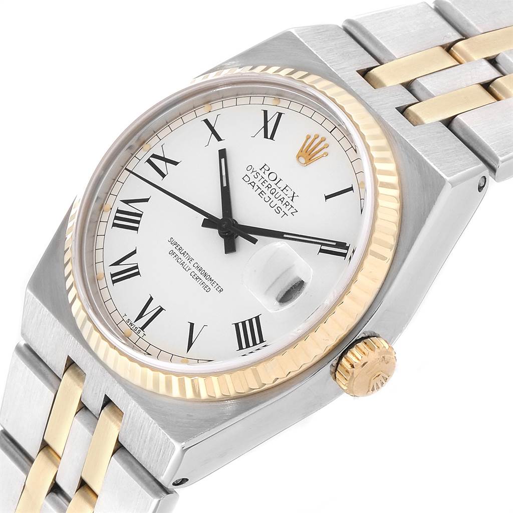 This image shows a close-up of the Rolex Oysterquartz 19220 Men's Steel and Gold (two tone) White Dial 19220 Men's Steel and Gold (two tone) White Dial Datejust watch from an angle that highlights the dial, bezel, and part of the bracelet.
