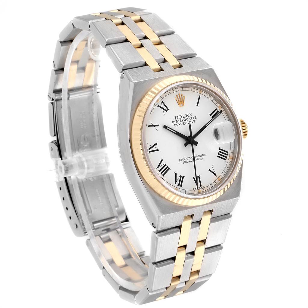 The image shows a Rolex Oysterquartz 19220 Men's Steel and Gold (two tone) White Dial 19220 Men's Steel and Gold (two tone) White Dial Datejust watch at an angle highlighting its band, dial, and case.