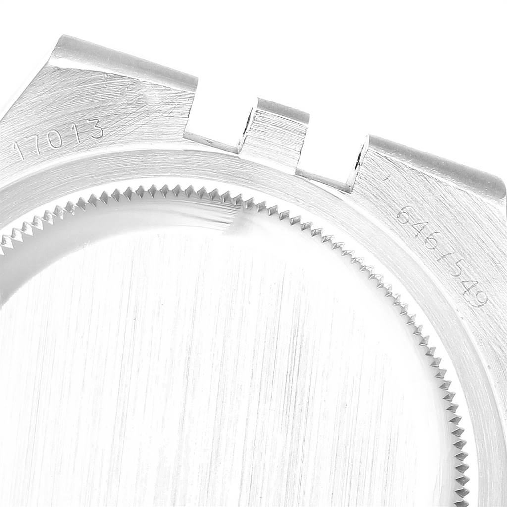 This is a close-up of the case center and bezel of a Rolex Oysterquartz 19220 Men's Steel and Gold (two tone) White Dial 19220 Men's Steel and Gold (two tone) White Dial model.