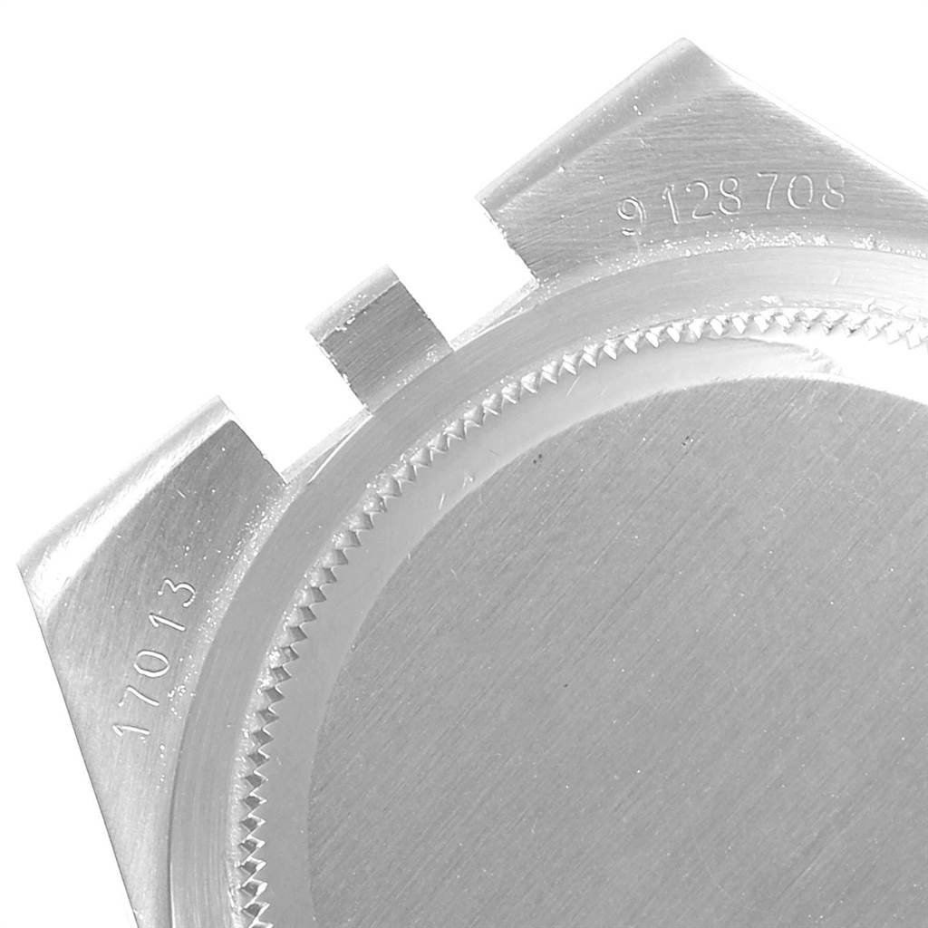 This image shows a partial close-up view of the back case of a Rolex Oysterquartz 16865 Men's Stainless Steel White Dial 16865 Men's Stainless Steel White Dial watch, featuring the model and serial numbers.