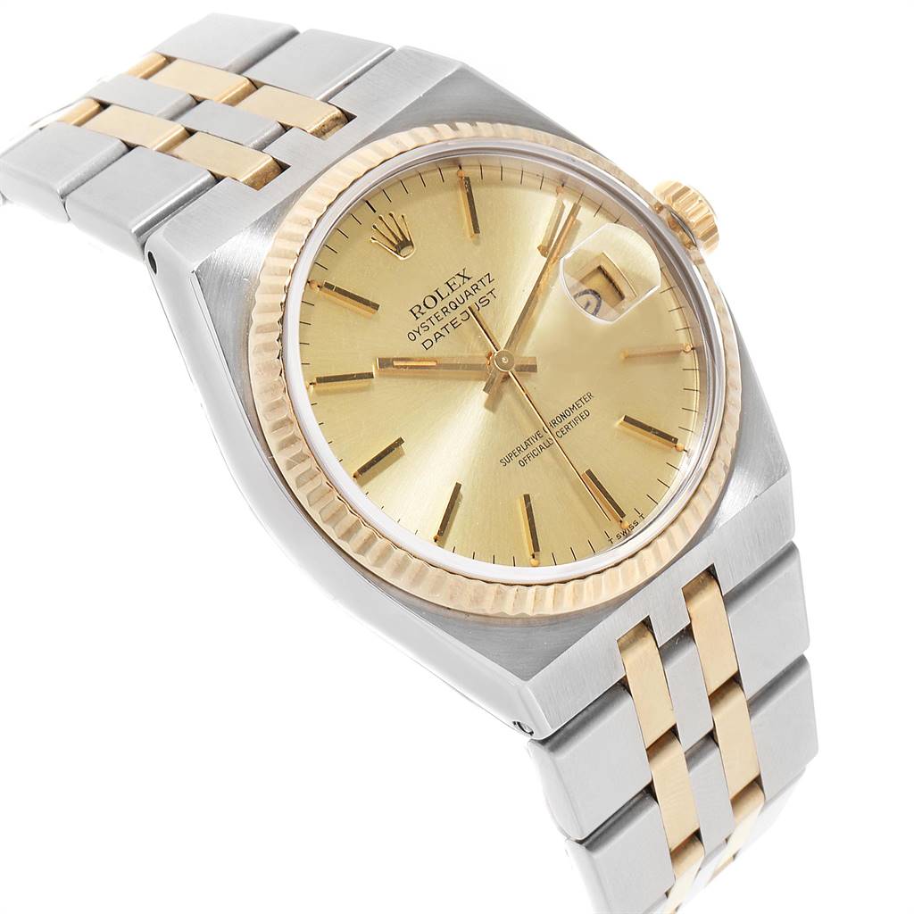 The Rolex Oysterquartz 17013 Men's Stainless Steel Champagne Dial 17013 Men's Stainless Steel Champagne Dial watch is shown at a slight angle, displaying its two-tone bracelet, gold dial, fluted bezel, and date window.