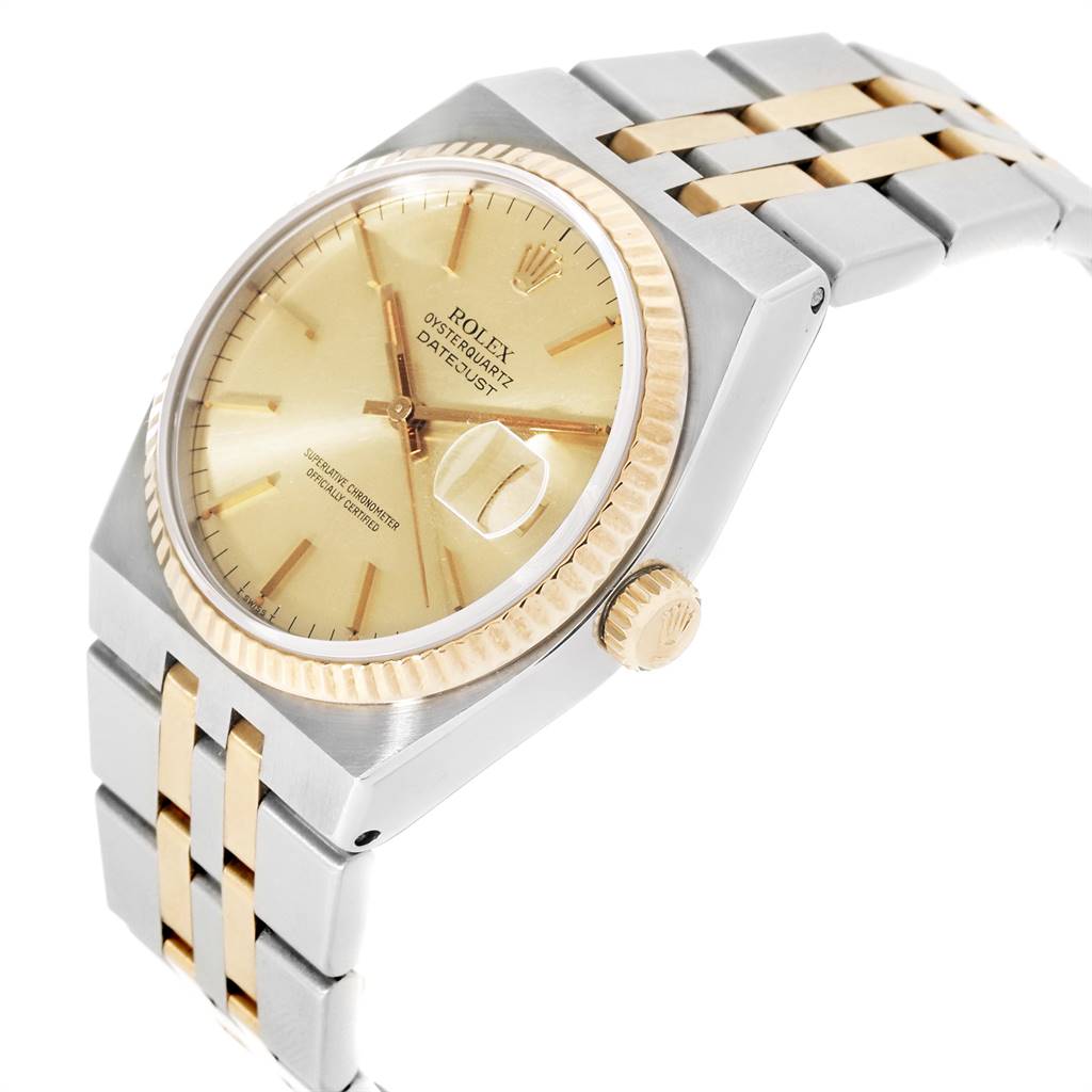 The image displays a side angle of a Rolex Oysterquartz 17013 Men's Stainless Steel Champagne Dial 17013 Men's Stainless Steel Champagne Dial watch, highlighting its gold dial, bezel, and two-tone bracelet.