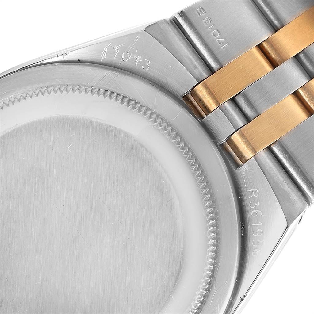 This image shows the back case and part of the bracelet of a Rolex Oysterquartz 17013 Men
s Stainless Steel Silver Dial 17013 Men
s Stainless Steel Silver Dial watch, viewed from the underside.