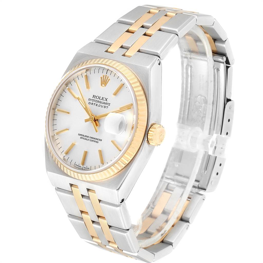 The Rolex Oysterquartz 17013 Men
s Stainless Steel Silver Dial 17013 Men
s Stainless Steel Silver Dial watch is shown at an angled view, highlighting its two-tone bracelet, white dial, and fluted bezel.