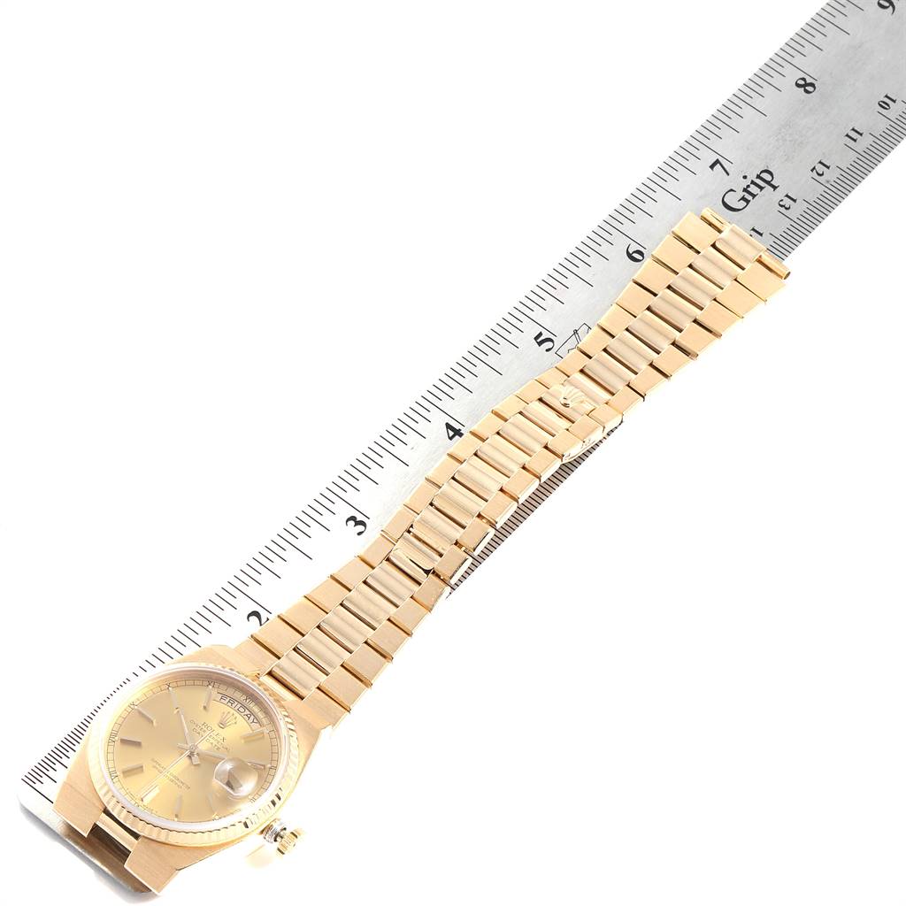 The image shows a Rolex Oysterquartz 19018 Men's Yellow Gold Champagne Dial 19018 Men's Yellow Gold Champagne Dial watch laid flat, with its dial, bracelet, and clasp visible, alongside a ruler for scale.