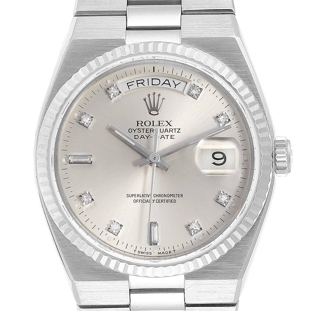 The image shows a Rolex Oysterquartz 19019 Men
s White Gold Silver Dial 19019 Men
s White Gold Silver Dial watch from a top-down angle, highlighting the face, hands, bezel, and part of the bracelet.