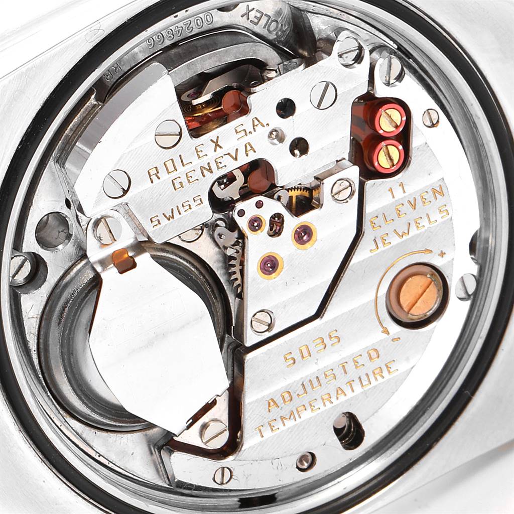 The image shows a close-up view of the movement mechanism of a Rolex Oysterquartz 19220 Men's Steel and Gold (two tone) White Dial 19220 Men's Steel and Gold (two tone) White Dial watch, highlighting internal components and inscriptions.