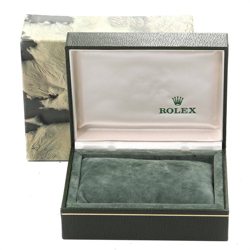 The image shows an open green Rolex box for the Oysterquartz model, with an empty cushioned interior and the brand logo on the inner lid.
