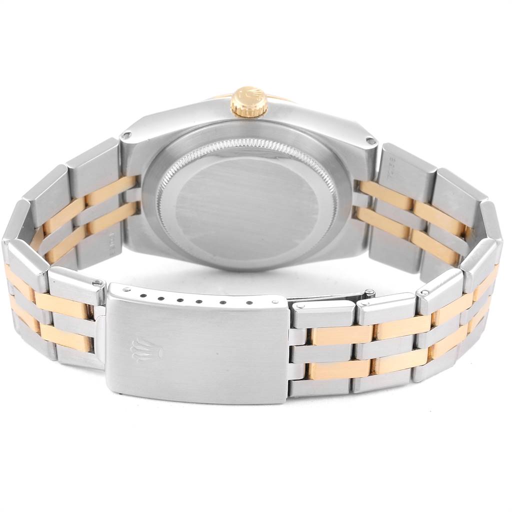 The image shows the back of a Rolex Oysterquartz 19220 Men's Steel and Gold (two tone) White Dial 19220 Men's Steel and Gold (two tone) White Dial watch, highlighting its two-tone bracelet and case back.