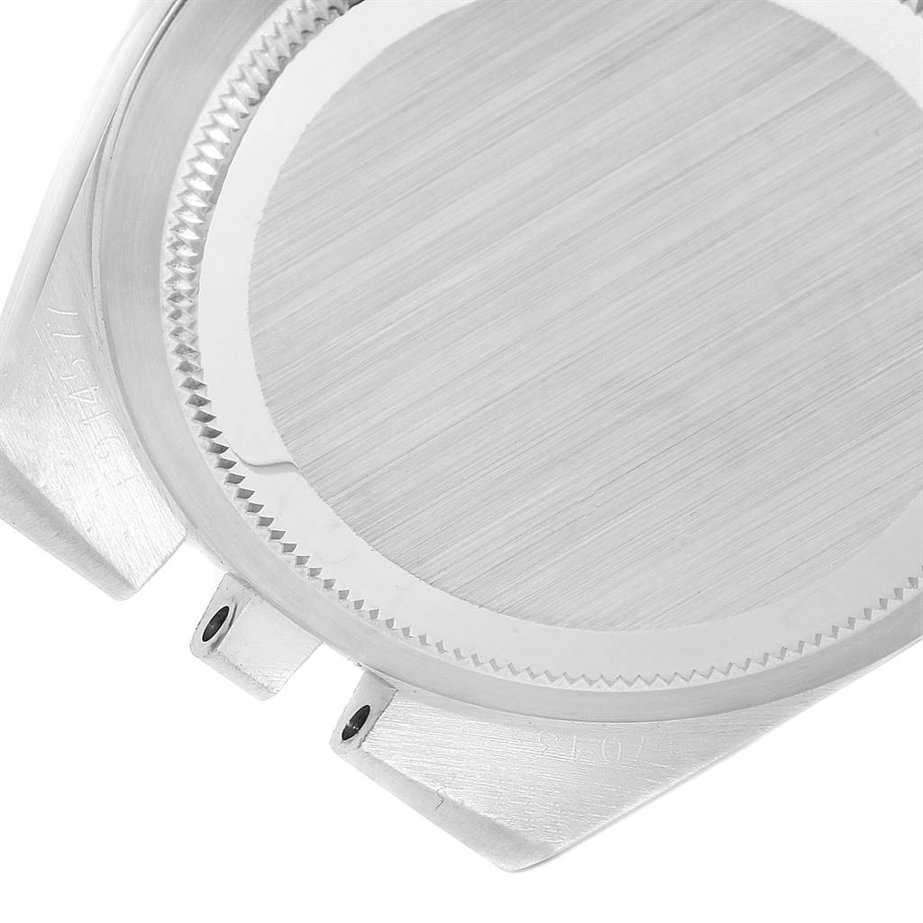 This image shows a partial view of the case back and lugs of a Rolex Oysterquartz 17013 Men
s Stainless Steel Champagne Dial 17013 Men
s Stainless Steel Champagne Dial watch from a top-down angle.