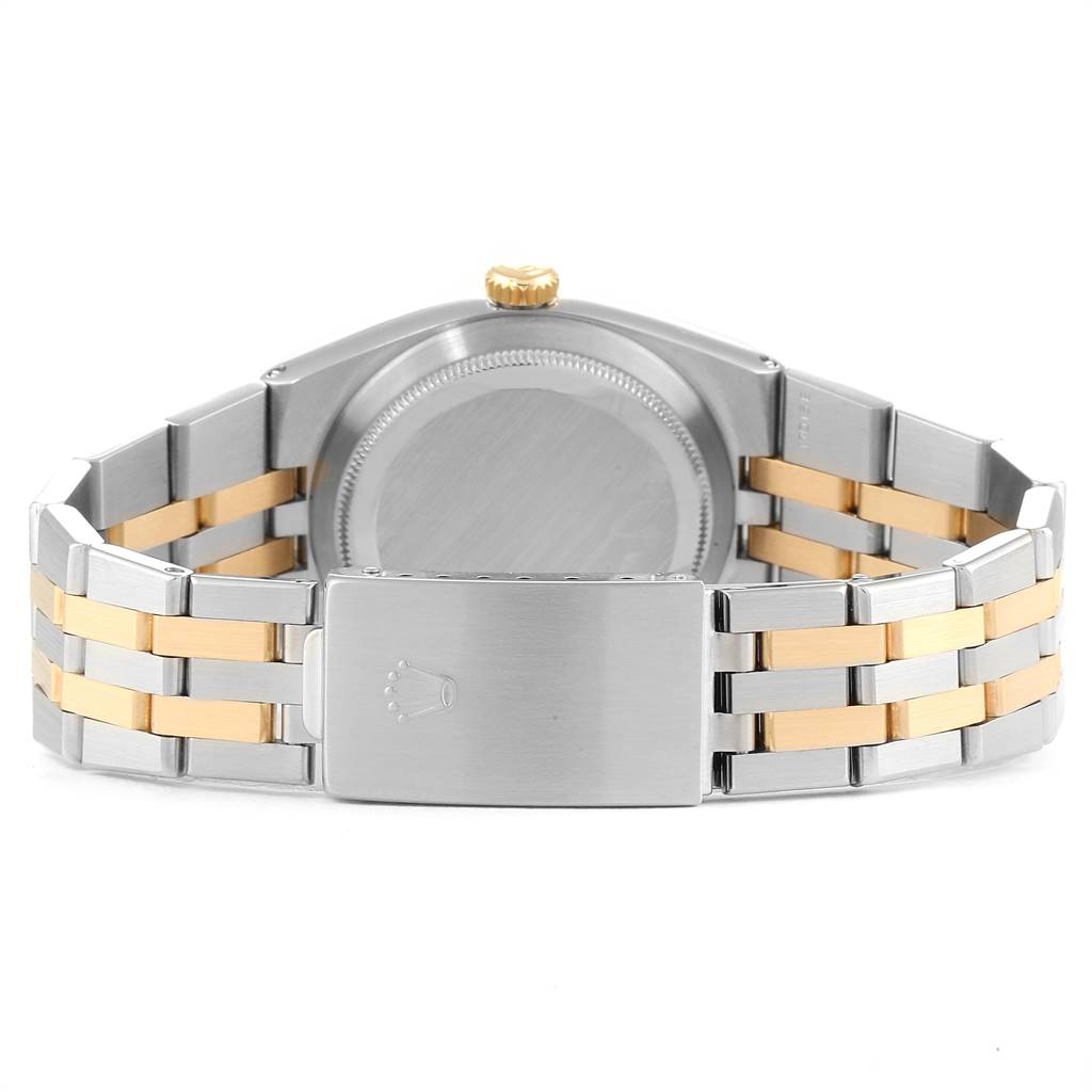 The image shows the back view of a Rolex Oysterquartz 17013 Men
s Stainless Steel Champagne Dial 17013 Men
s Stainless Steel Champagne Dial watch, highlighting the clasp and bracelet.