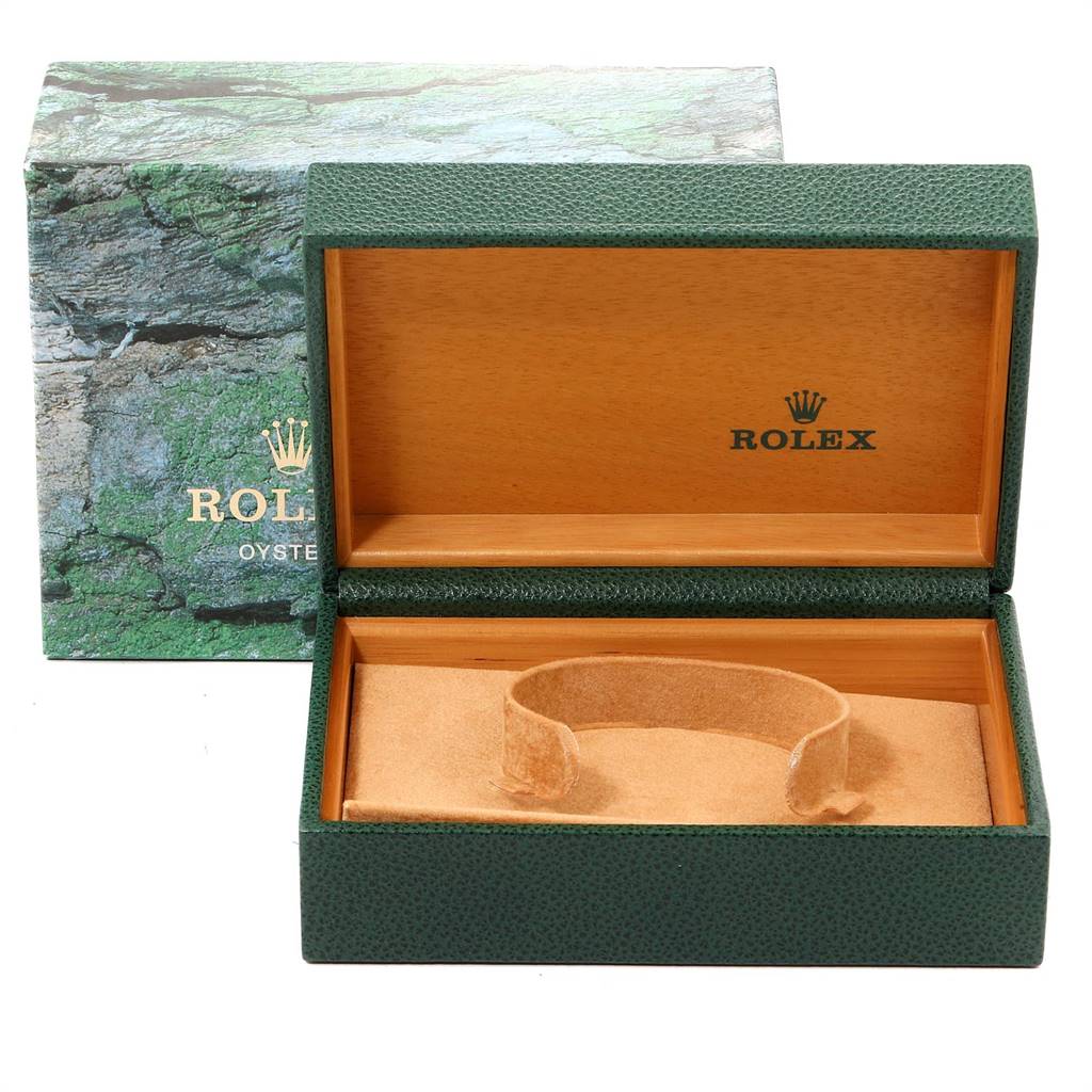 The image shows the open green leather and wood presentation box for the Rolex Oysterquartz 17000 Men's Stainless Steel White Dial 17000 Men's Stainless Steel White Dial watch with its cushion removed and visible.