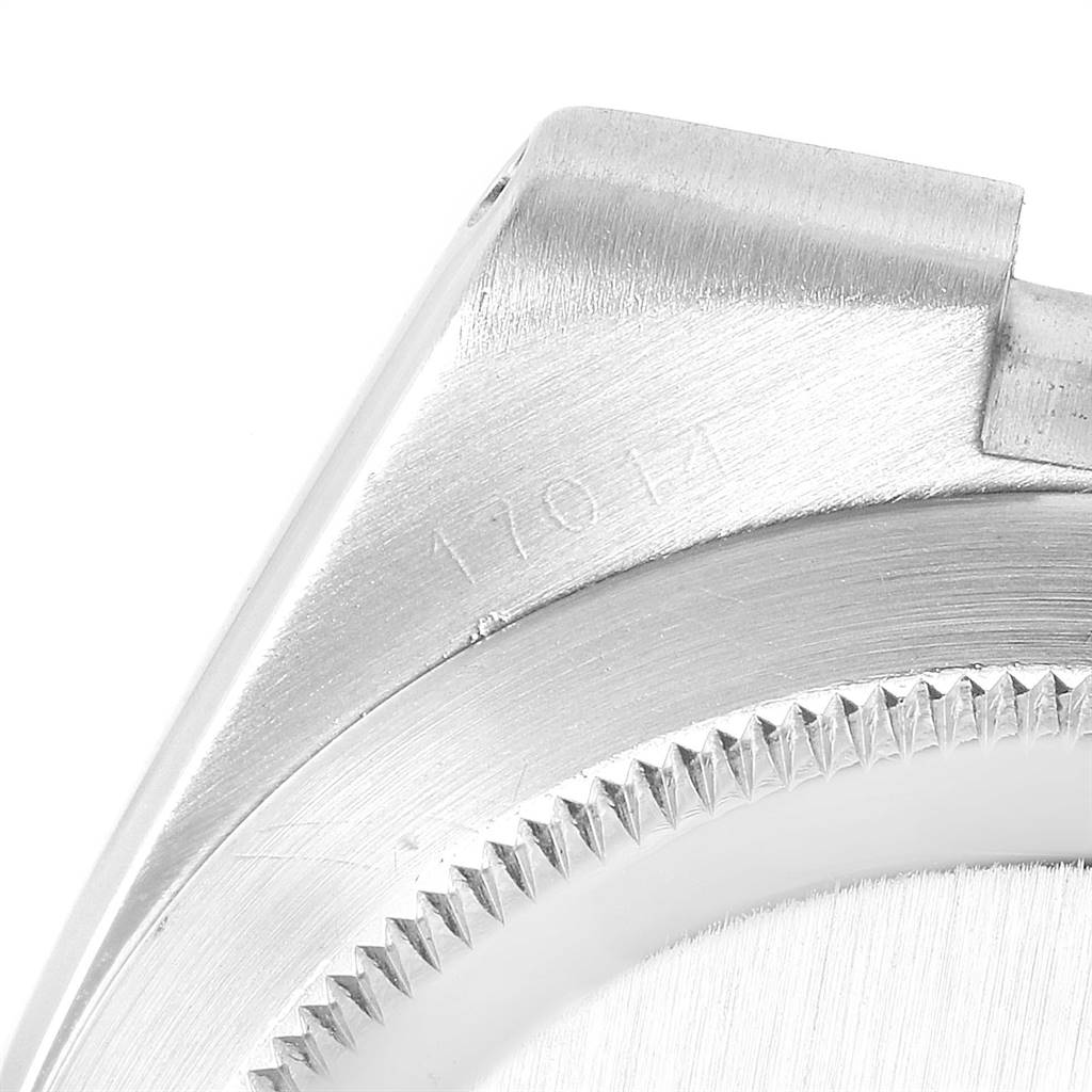 This image shows a close-up of the side and bezel of a Rolex Oysterquartz 19601 Men's Stainless Steel White Dial 19601 Men's Stainless Steel White Dial model, highlighting the model number and brushed finish.