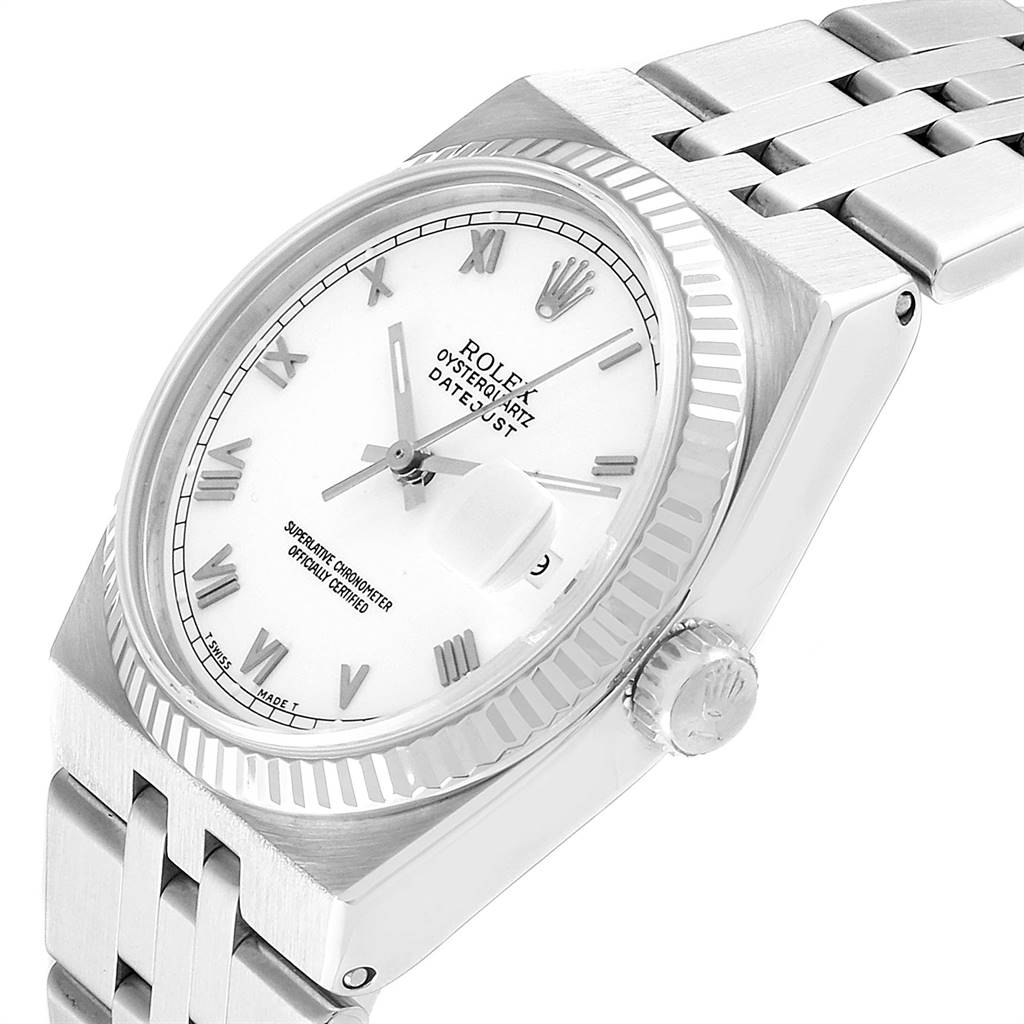 The image shows a Rolex Oysterquartz 19601 Men's Stainless Steel White Dial 19601 Men's Stainless Steel White Dial Datejust watch from an angled top-down perspective, highlighting its face, bezel, and bracelet.