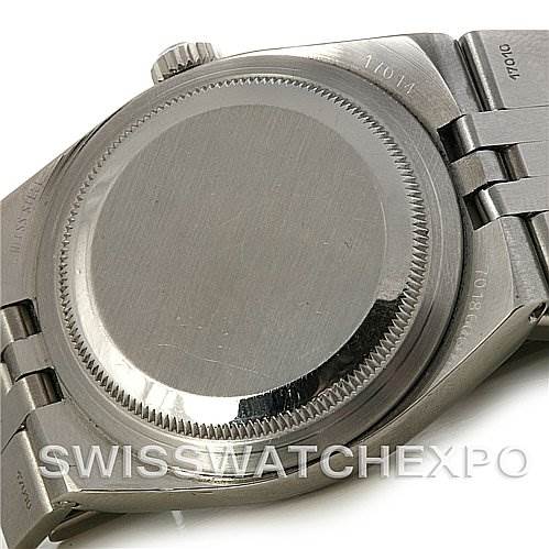 This image shows the case back and part of the bracelet of a Rolex Oysterquartz 17014 Men's Stainless Steel Silver Dial 17014 Men's Stainless Steel Silver Dial watch from a low angle.