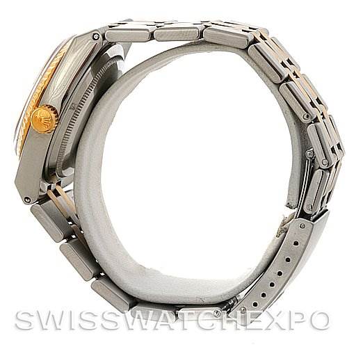 Side view of a Rolex Oysterquartz 17013 Men's Stainless Steel White Dial 17013 Men's Stainless Steel White Dial watch displaying the crown, bracelet, and part of the case.