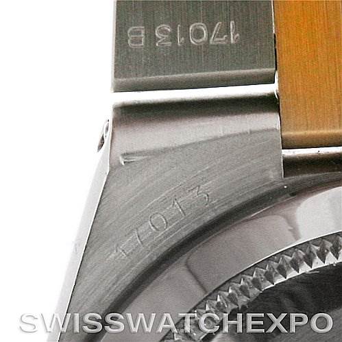 This close-up image shows the serial number and the edge of the bezel of a Rolex Oysterquartz 17013 Men's Stainless Steel White Dial 17013 Men's Stainless Steel White Dial watch.