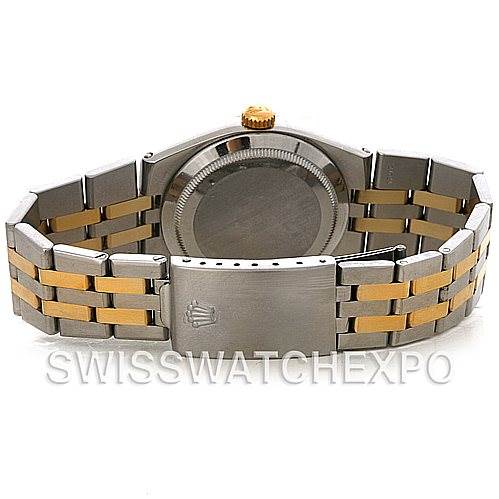 The image shows the back view of a Rolex Oysterquartz 17013 Men's Stainless Steel Champagne Dial 17013 Men's Stainless Steel Champagne Dial watch, highlighting its case back, bi-color bracelet, and clasp.