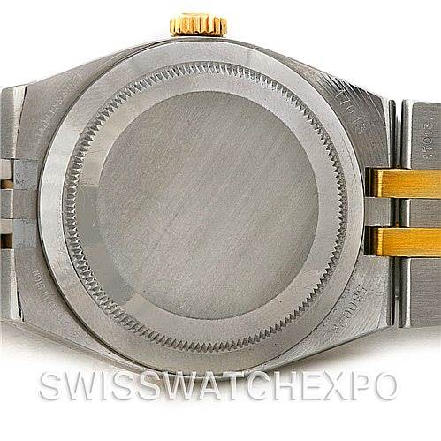 This image shows the case back and part of the bracelet of a Rolex Oysterquartz 17013 Men's Stainless Steel Champagne Dial 17013 Men's Stainless Steel Champagne Dial watch.