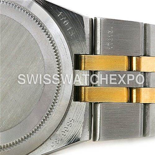 This close-up shows the case back and the start of the bracelet of the Rolex Oysterquartz 17013 Men's Stainless Steel Champagne Dial 17013 Men's Stainless Steel Champagne Dial watch.