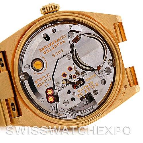 The image shows the open case back of a Rolex President 19018 Men's Yellow Gold Black Dial 19018 Men's Yellow Gold Black Dial model, revealing its inner mechanical movement components.