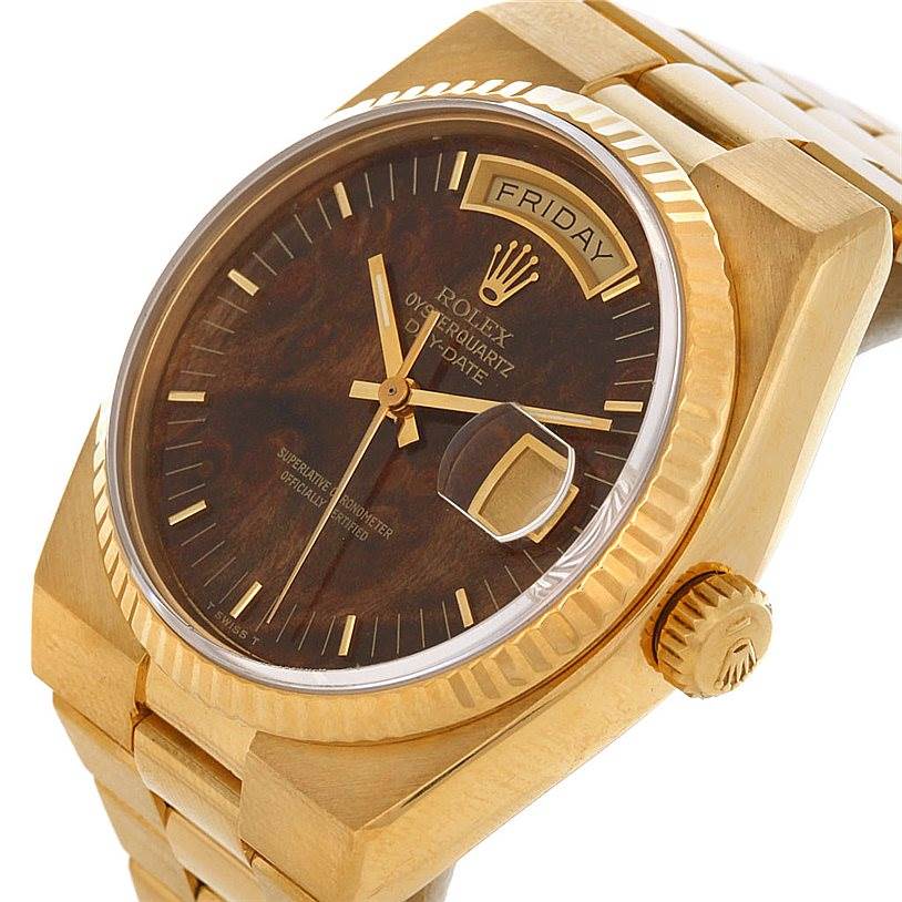 The image shows a Rolex Oysterquartz 19018 Men
s Yellow Gold Champagne Dial 19018 Men
s Yellow Gold Champagne Dial watch at an oblique angle, highlighting the dial, crown, and part of the bracelet.