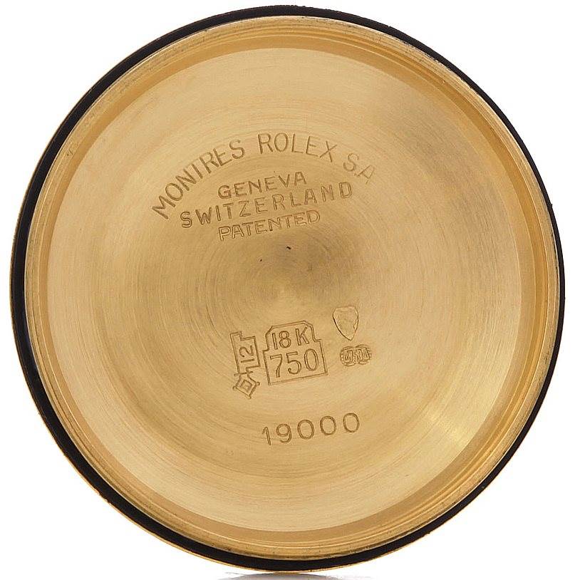 This image shows a close-up of the case back for a Rolex Oysterquartz 19018 Men
s Yellow Gold Champagne Dial 19018 Men
s Yellow Gold Champagne Dial model, displaying engravings and markings.