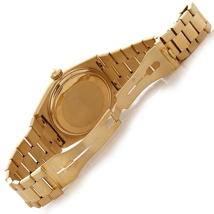 The image shows the back and bracelet of a Rolex Oysterquartz 19018 Men
s Yellow Gold Champagne Dial 19018 Men
s Yellow Gold Champagne Dial watch, taken from an angled bottom view.