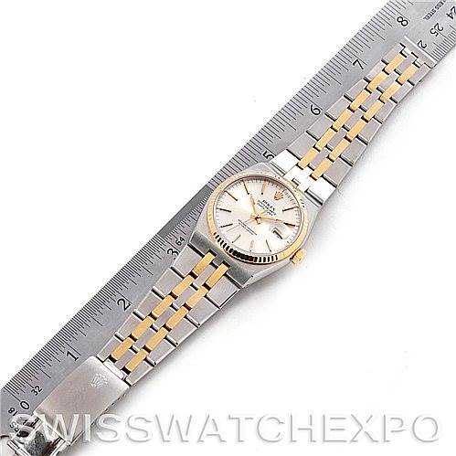 The image shows a top view of a Rolex Oysterquartz 17013 Men's Stainless Steel Silver Dial 17013 Men's Stainless Steel Silver Dial watch with a metal bracelet, placed next to a ruler for scale.