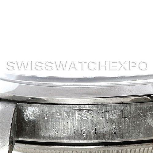 The image shows a close-up of the case side of a Rolex Oysterquartz 14000 Men's Stainless Steel Black Dial 14000 Men's Stainless Steel Black Dial watch, highlighting the "Stainless Steel" and serial number engraving.