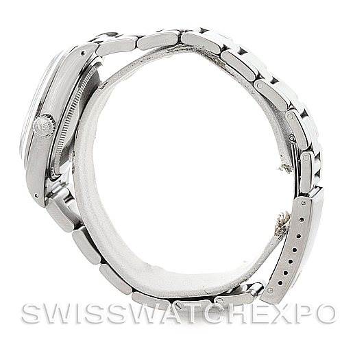 The image shows a side view of a Rolex Oysterquartz 14000 Men's Stainless Steel Black Dial 14000 Men's Stainless Steel Black Dial watch, highlighting the case, crown, and bracelet.