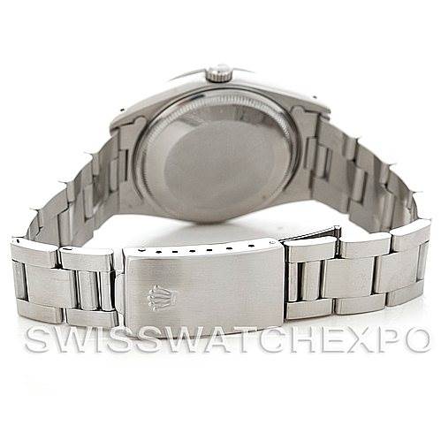 The image shows the back view of a Rolex Oysterquartz 14000 Men's Stainless Steel Black Dial 14000 Men's Stainless Steel Black Dial watch, highlighting its case back, crown, and stainless steel bracelet with clasp.