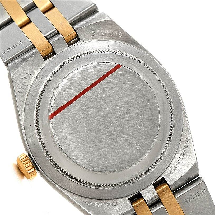 The image shows the case back and part of the bracelet for the Rolex Oysterquartz 17013 Men's Stainless Steel Champagne Dial 17013 Men's Stainless Steel Champagne Dial watch, with a close-up angle.