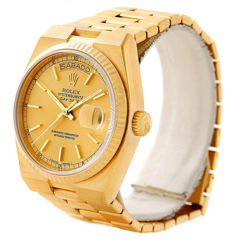 The image shows a Rolex Oysterquartz 19018 Men's Yellow Gold Champagne Dial 19018 Men's Yellow Gold Champagne Dial watch from a front angle, highlighting its gold dial, day-date display, and bracelet.