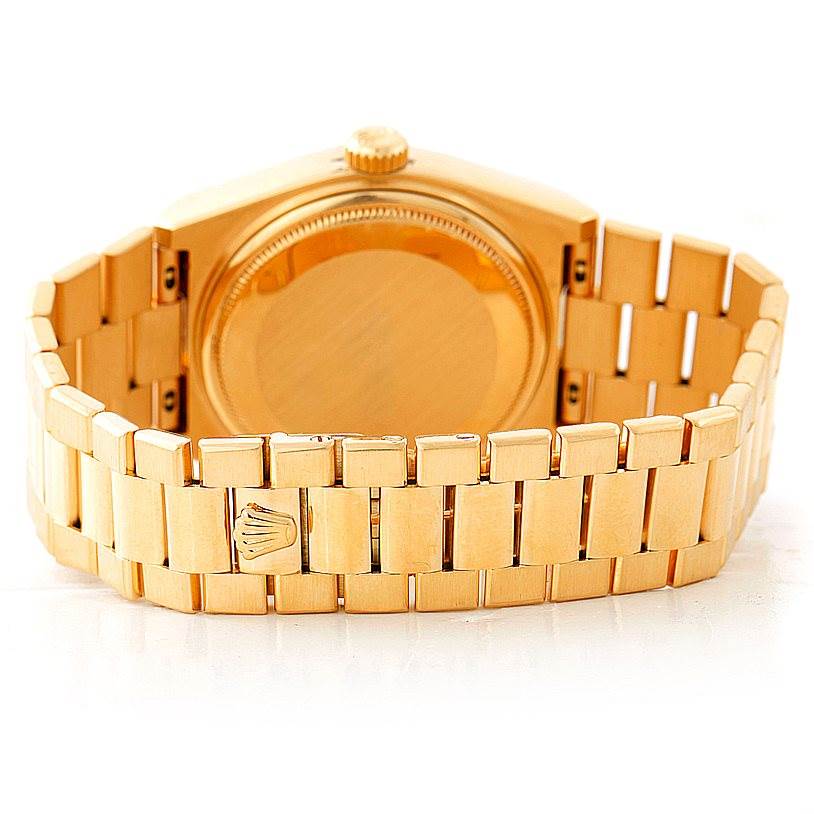 The image shows the rear view of a Rolex Oysterquartz 19018 Men's Yellow Gold Champagne Dial 19018 Men's Yellow Gold Champagne Dial watch, focusing on its caseback and bracelet.