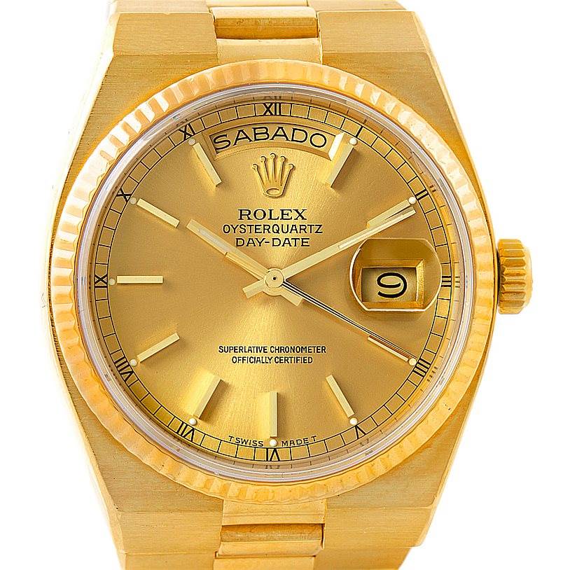 The image shows a frontal view of a gold Rolex Oysterquartz 19018 Men's Yellow Gold Champagne Dial 19018 Men's Yellow Gold Champagne Dial Day-Date watch, highlighting the dial, hands, date window, and crown.