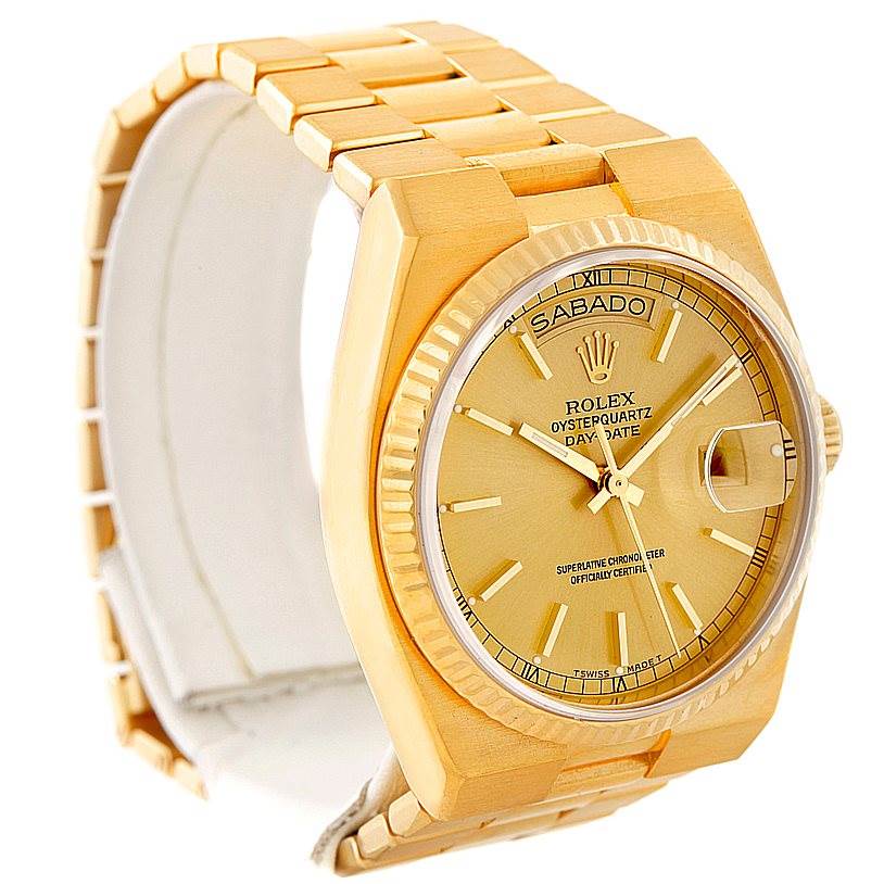 The Rolex Oysterquartz 19018 Men's Yellow Gold Champagne Dial 19018 Men's Yellow Gold Champagne Dial watch is shown at a three-quarter angle, displaying the face, bracelet, and case.