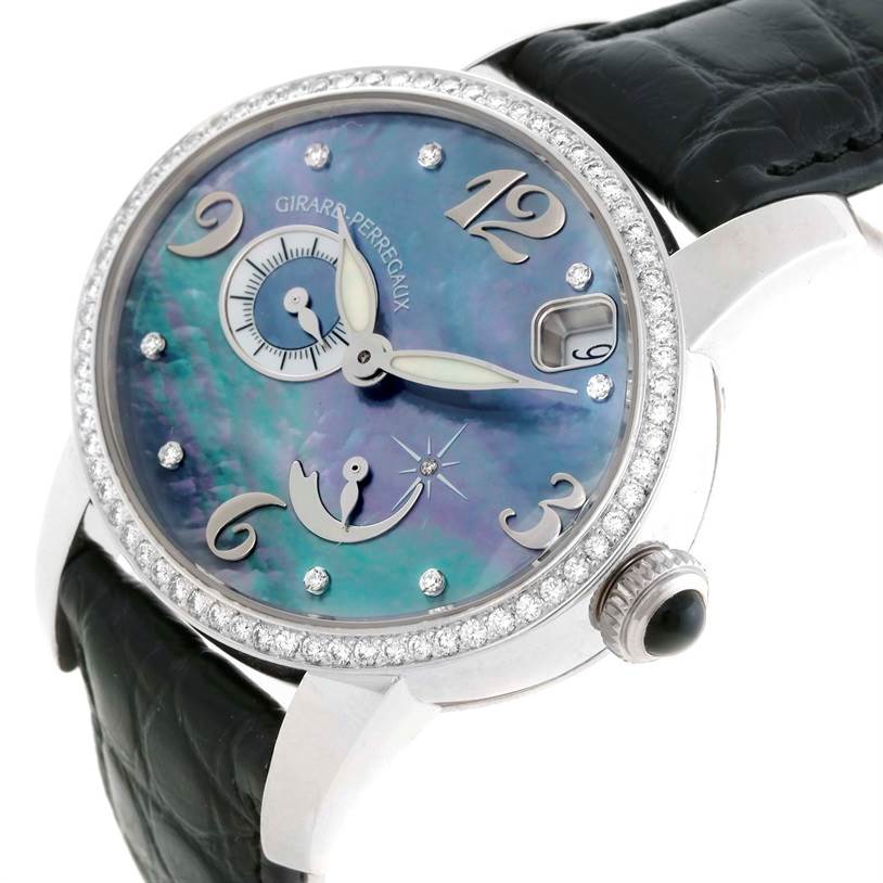 The image shows a close-up of the Girard-Perregaux 80481 Women's White Gold Mother of Pearl Dial 80481 Women's White Gold Mother of Pearl Dial Cat's Eye 80481 watch, focusing on the dial, case, crown, and part of the strap.
