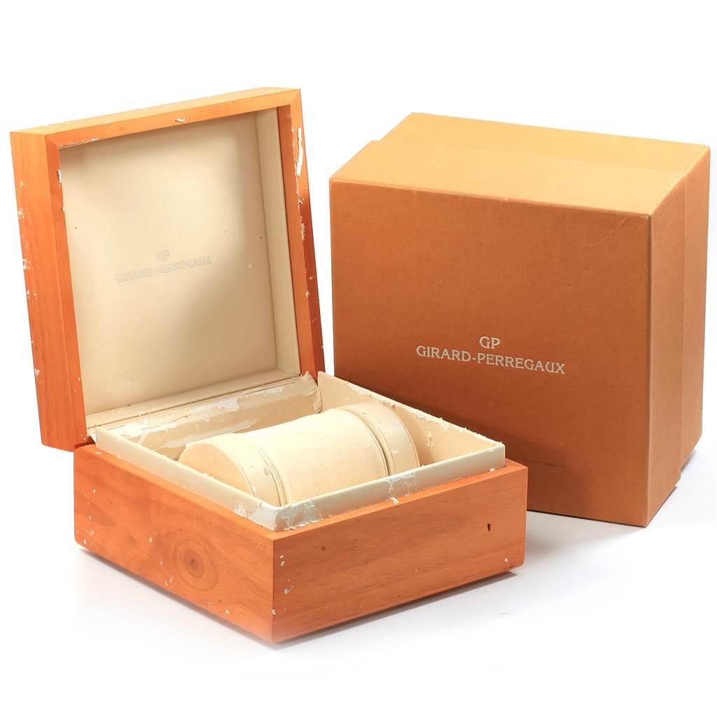This image shows the Girard-Perregaux 9021 Men's Rose Gold Silver Dial 9021 Men's Rose Gold Silver Dial 1945 Rose Gold Split Second Chrono Watch 9021's open wooden box and outer cardboard packaging.